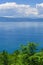 panoramic mediterranean blue sea and sky amd green Pine trees