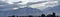 Panoramic misty view of angel rays from Sunrise and the Wasatch Front Rocky Mountain range looking East in Salt Lake City Utah in