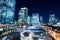 Panoramic modern city skyline bird eye aerial night view with tokyo station under dramatic glow and beautiful dark blue sky in To