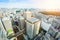 Panoramic modern city skyline bird eye aerial view of Meiji Shrine under dramatic sun and morning blue cloudy sky in Tokyo, Japan