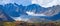 Panoramic mountain view. Large glacier  rocky peaks