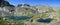 Panoramic mountain view. Rocky mountain slopes, two lakes.