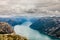 Panoramic mountain view to the long narrow and blue Lysefjord, Prekestolen hiking trail, Forsand, Rogaland county, Norway