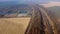 Panoramic Moving Freight Train Along Railway Tracks, Trees Agricultural Fields