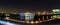 A panoramic nightscape of Yokoham bay with the Yokohama Bay Bridge in the distance