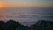 Panoramic ocean sunset view with peaceful seascape. Ocean water reflecting glow