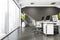 Panoramic office room with white desk, grey floors and squared lights