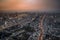 Panoramic Osaka cityscape in orange sky twilight time, with street, movement light, building and landmark