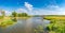 Panoramic over forests, lake and rasp yellow field near Magdeburg at late Spring, Germany