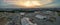 Panoramic overview over the popular Oktoberfest under construction at the late evening sunset.