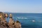 Panoramic perspective into the ocean from the rocky cliffs of Ponta da Piedade in Lagos, Portugal.