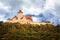 Panoramic photo of the castle called: Veste Wachsenburg in Thuringia. View of the entire castle in the countryside with forest in