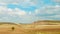 Panoramic photo of majestic cloudscape over dry autumnal agricultural land. Teruel, Aragon, Spain. Soft tone, vivid cyan colour