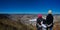 Panoramic photo with mother with daughter and son  on top of the mountain watching the city Pocos de Caldas - Minas Gerais/Brazil