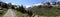 Panoramic photo of mountain landscape in the Forni Valley, path