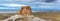 Panoramic photograph of desert butte with dramatic sky near Lake Powell