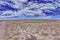 Panoramic picture over the Namibian Kalahari with blue sky and light clouds