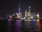 Panoramic picture of skyscrapers of Pudong district from the Bund in Shanghai at night in winter