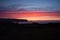 Panoramic pink pastel sky sunrise view of Kirkjufjara and Reynisfjara black volcanic rock beach Vik South Iceland Europe