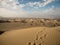Panoramic postcard view of footprint desert dry sand dunes texture pattern oasis of Huacachina Ica Peru South America