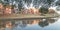 Panoramic riverside apartment building reflection at sunset in suburban Dallas