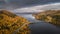 Panoramic road Wilderness Road with bridge over lake and trees in autumn in Lapland in Sweden from above