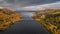 Panoramic road Wilderness Road with bridge over lake and trees in autumn in Lapland in Sweden from above