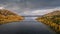 Panoramic road Wilderness Road with bridge over lake and trees in autumn in Lapland in Sweden from above