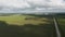 Panoramic rotation over fields and rural roads aerial view