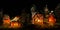 Panoramic scene of miniature Christmas countryside with lit tiny ceramic houses