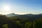 Panoramic scenery of the mist shrouded mountains at sunset