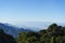 Panoramic scenery of the mist shrouded mountains at sunset