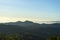 Panoramic scenery of the mist shrouded mountains at sunset