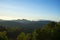 Panoramic scenery of the mist shrouded mountains at sunset