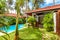 Panoramic scenic view of nice villa. Swimming pool in tropical hotel or vacation home