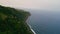 Panoramic sea shore landscape on rainy cloudy day. Aerial dark ocean washing