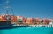 Panoramic seascape on colorful Marina promenade street from Red Sea with moored motor yachts. Marina, Hurghada, Egypt