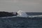 Panoramic seascape. Huge waves crashing into huge stones against the sky and horizon. West seashore of Tenerife