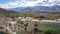 Panoramic shot of the city of Lhasa stretching towards the rocky Himalaya.