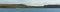 Panoramic shot of the cloudy sky covering the green cliffs on the shore of the lake
