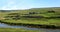 Panoramic shot of the countryside. On a Sunny summer day. Village on the banks of the river.