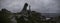 Panoramic shot of Faro Punta Nariga under a cloudy dark sky