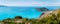 Panoramic shot of Frourio peninsular with cute Assos village surrounded by beautiful blue sea. Kefalonia island, Greece