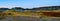 Panoramic shot of geological mountain formations on background of the blue sky