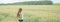 Panoramic shot of a girl in a field