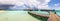 Panoramic shot of a long empty jetty in the Maldives with coral reefs in the water