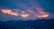 Panoramic shot of mountain scenery during sunset, blue hour and pink dramatic skies and light