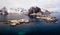 Panoramic shot over Norway Lofoten aerial landscape in winter time with rainbow and mountains covered in snow