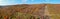 Panoramic shot of rolling hills of fall foliage