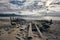 Panoramic shot of a shipwrecked boat on the shore of Rossbeigh strand